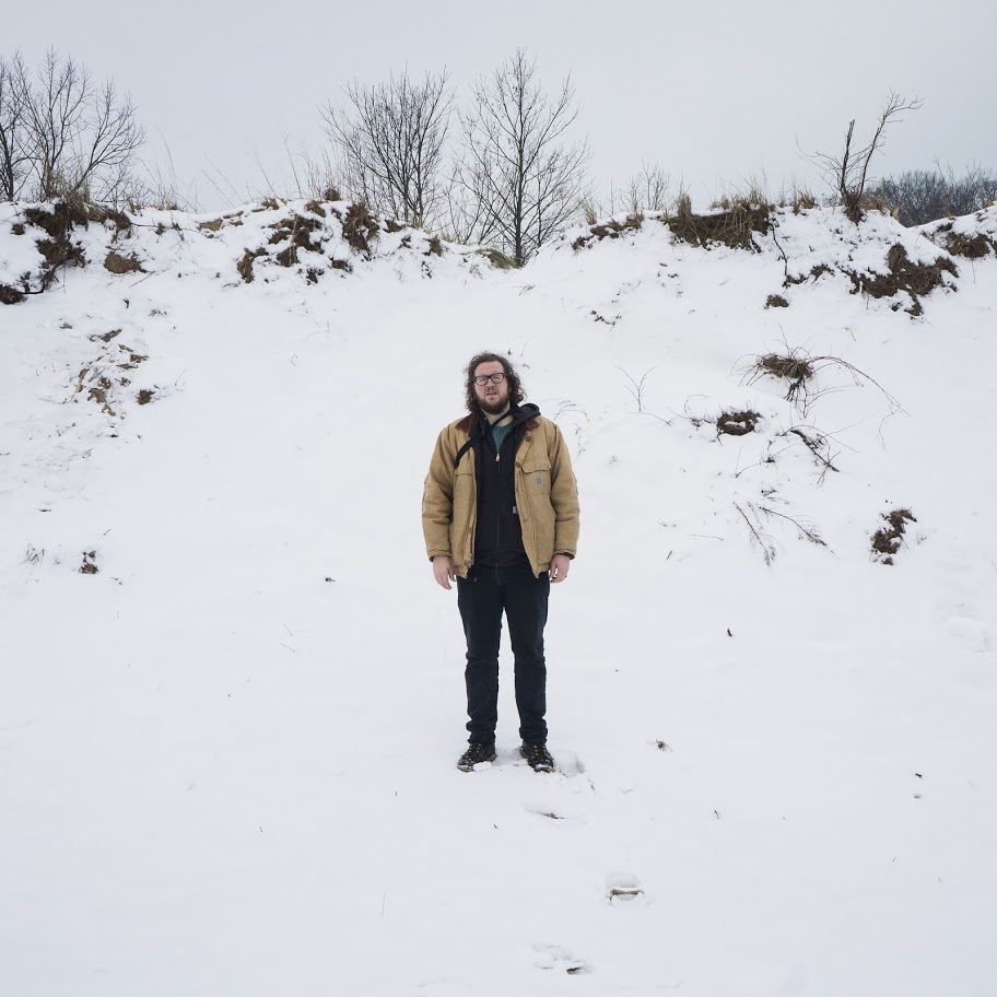portrait of Jake Francis standing in the snow